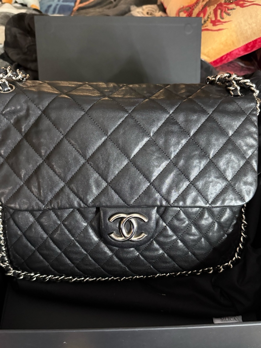 Chanel Maxi chain around black lambskin single flap